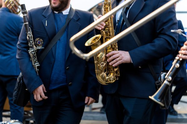 Band musicians with their instruments on the street. Typical music bands in Spain. Band musicians with their instruments on the street. Typical music bands in Spain.